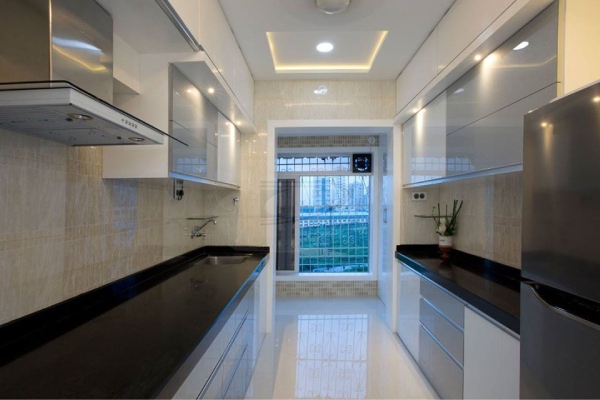 Galley Kitchen with white- grey cabinets & black granite countertop